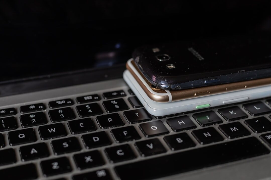 Laptop and smartphone showing encrypted messaging